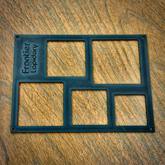 black plastic sheet with rectangles cut out