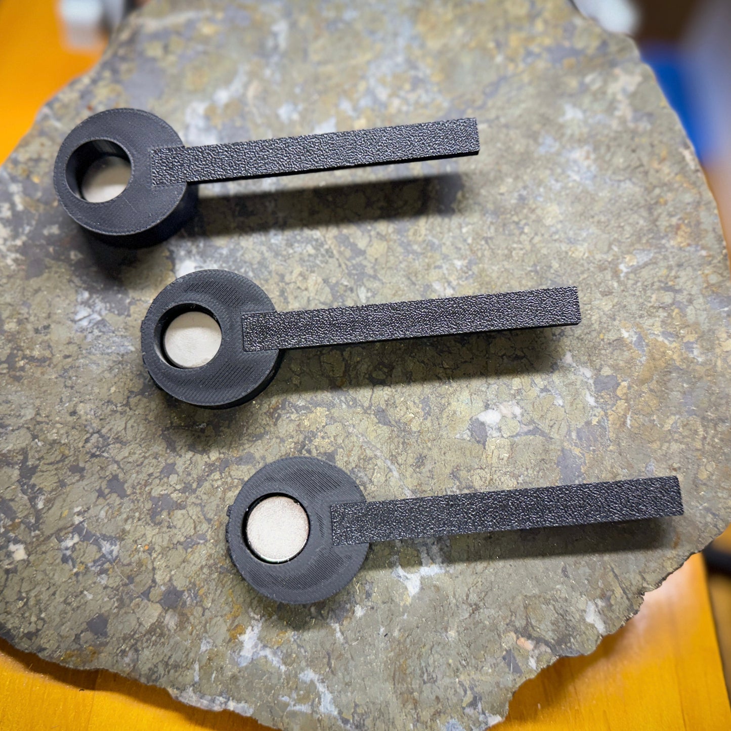 black plastic tools on metallic surface from above