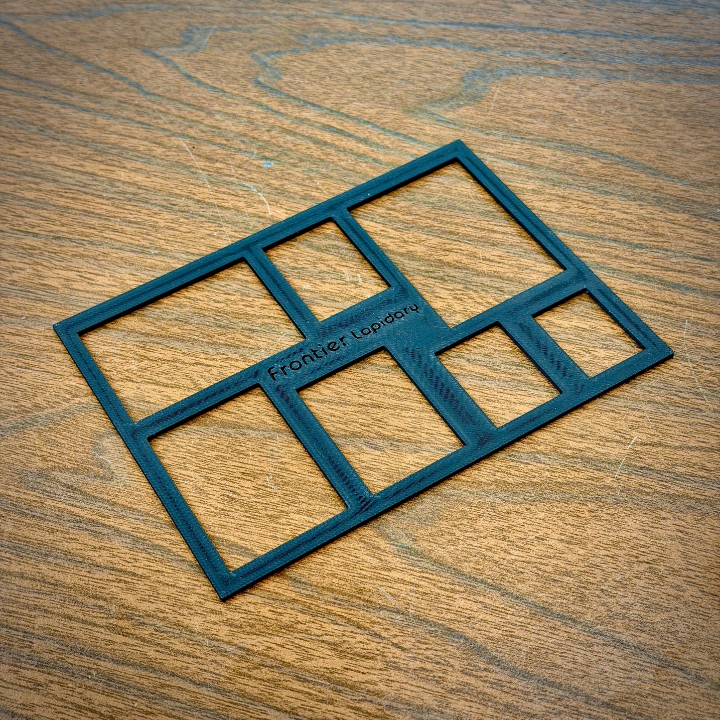 black plastic sheet with rectangles cut out