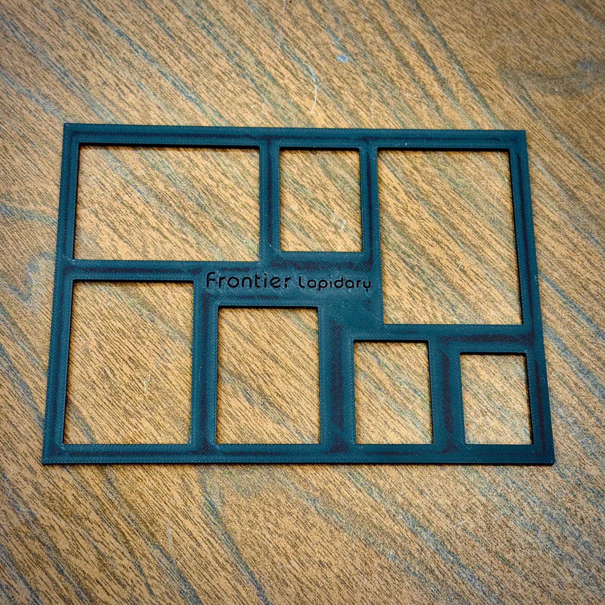 black plastic sheet with rectangles cut out