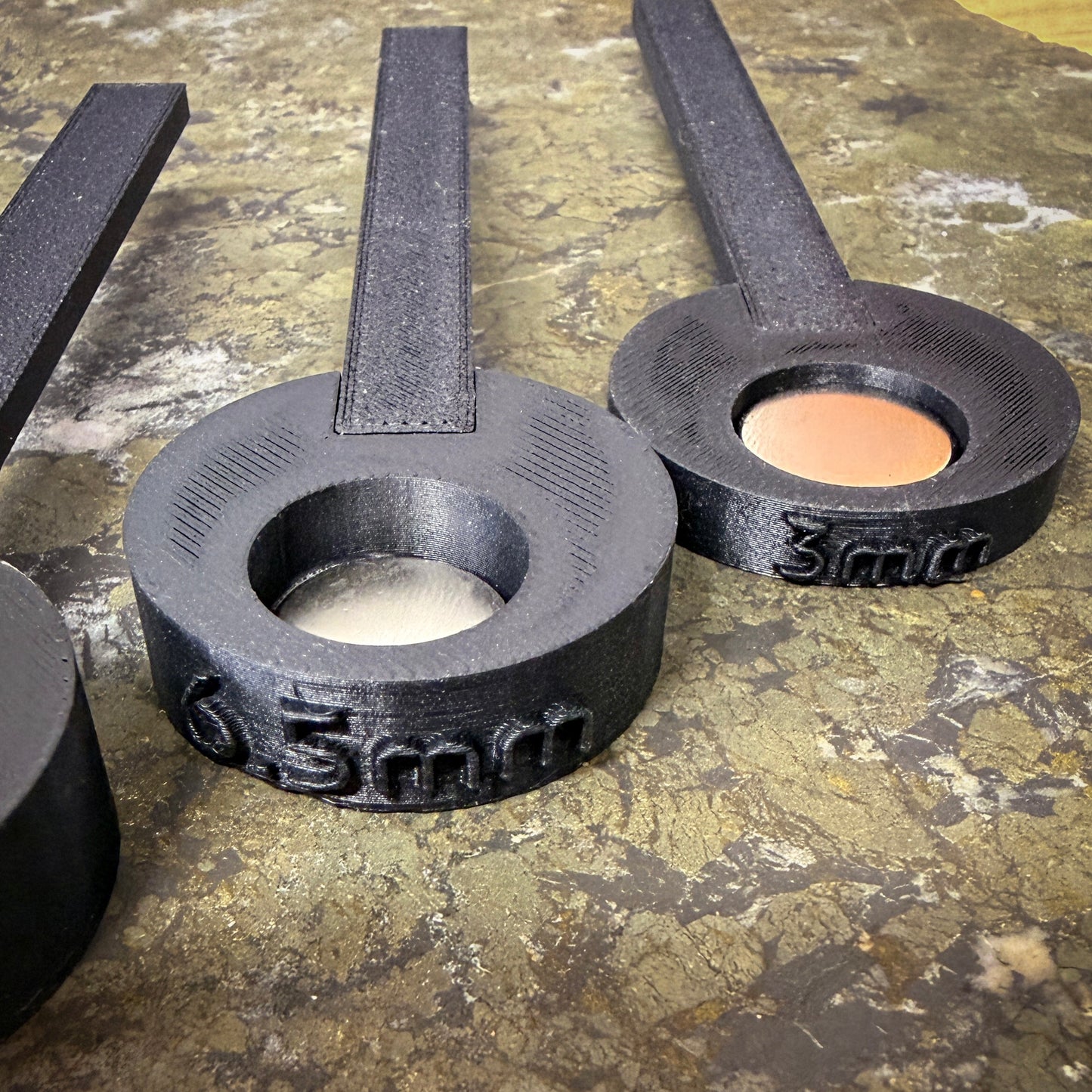 black plastic tool on metallic surface