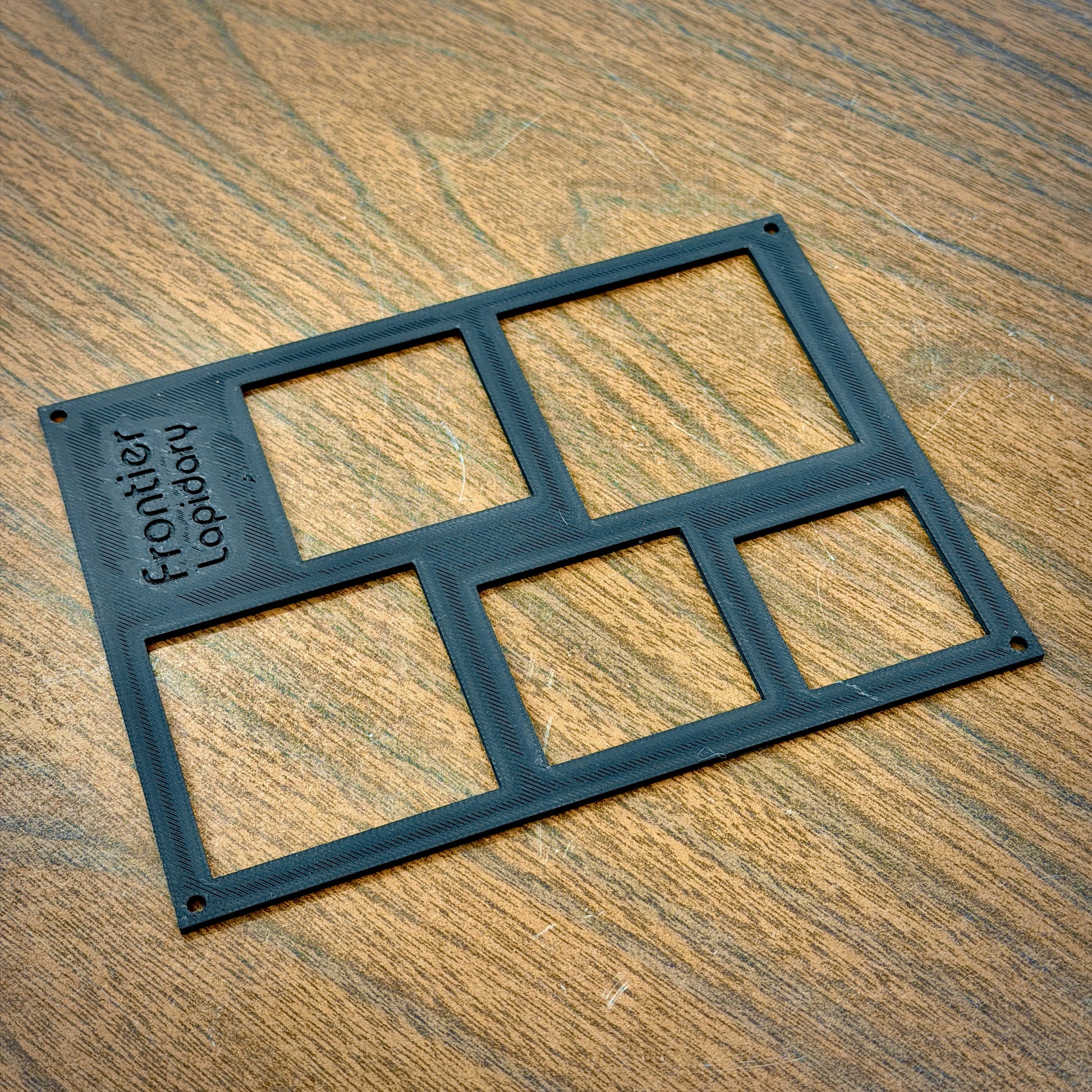black plastic sheet with rectangles cut out