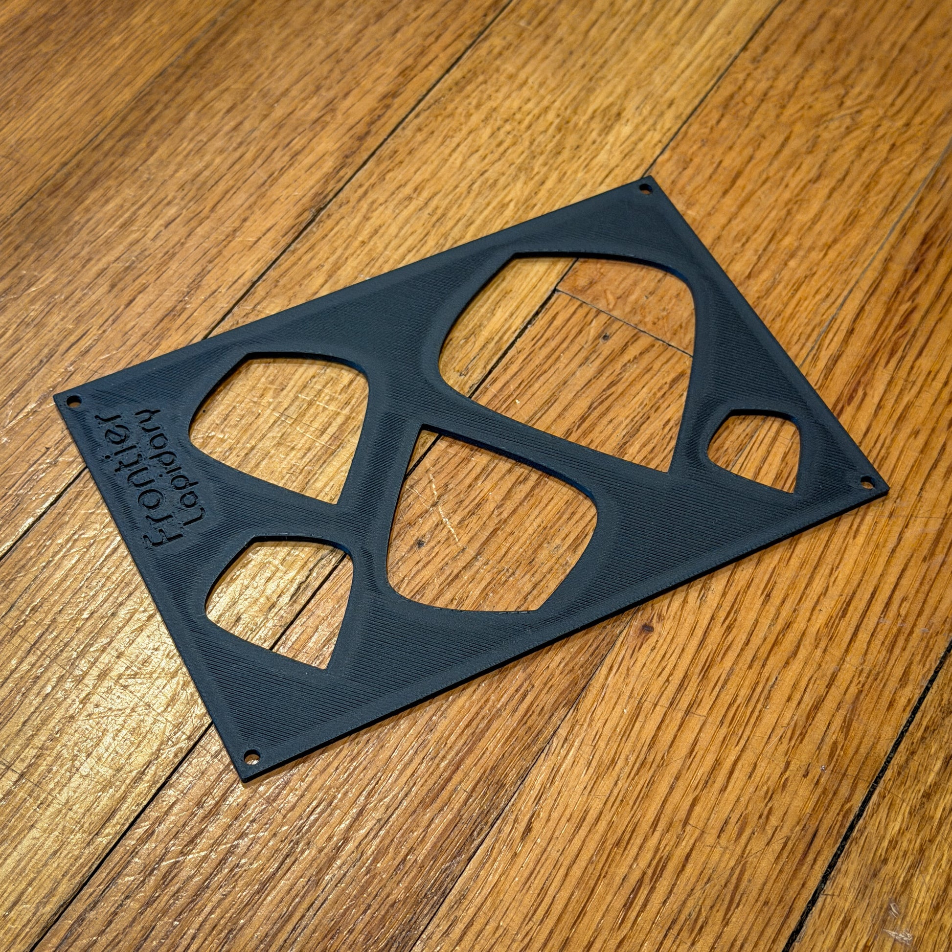 black plastic sheet with shapes cut out