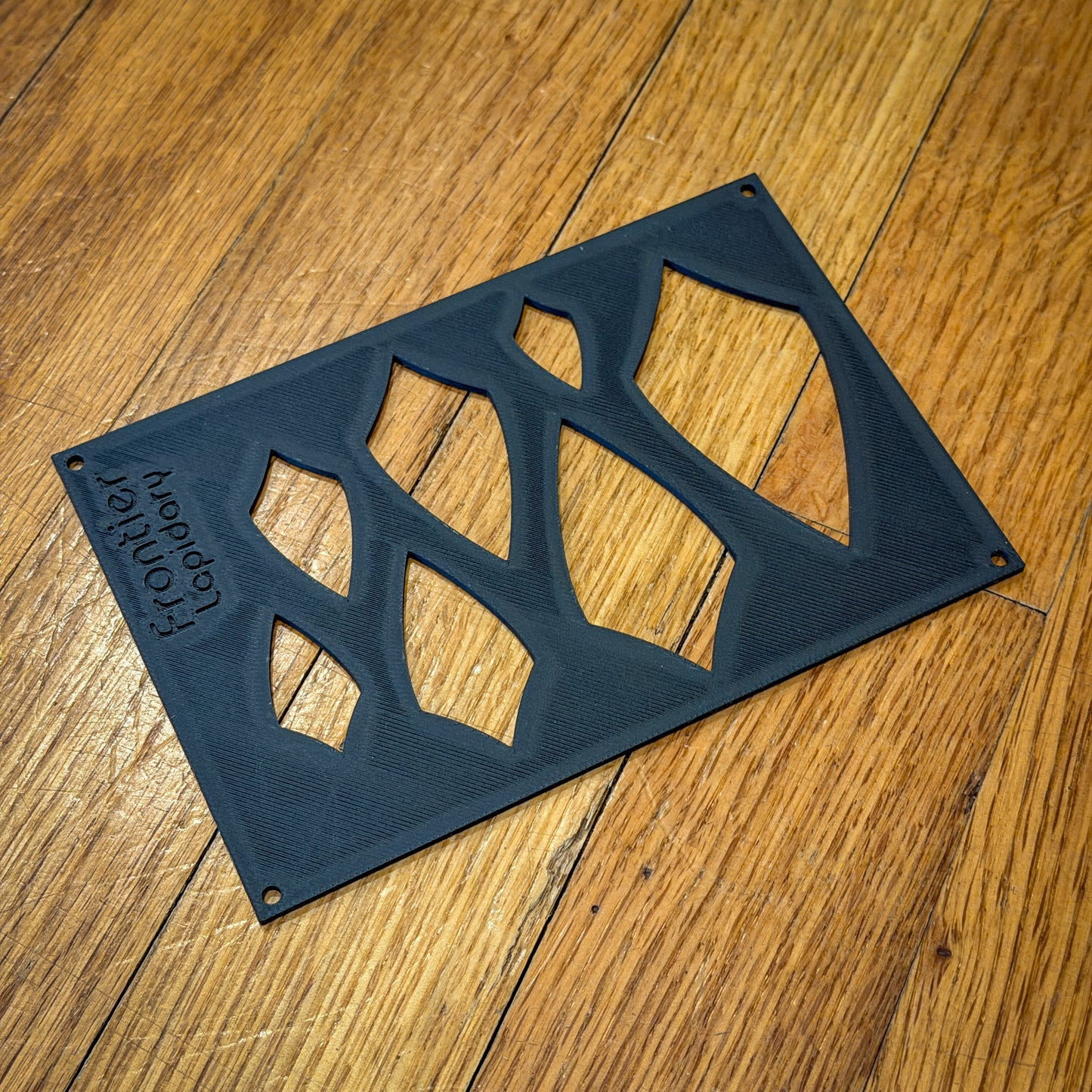 black plastic sheet with shapes cut out